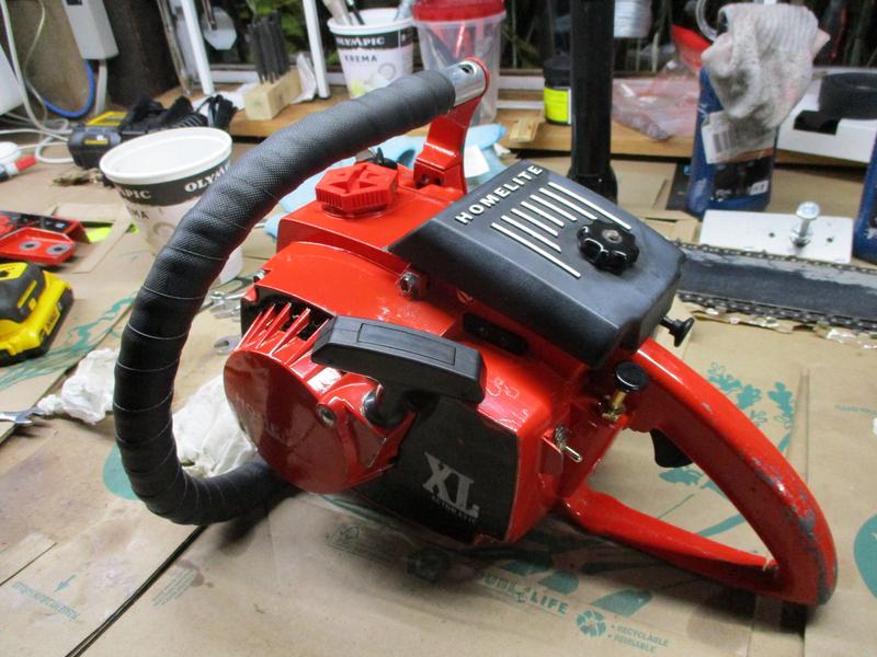 XL-AO Chainsaw sitting on bench