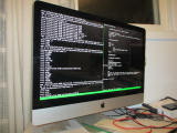 imac sitting on desk with terminals open on screen