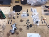 Rear master cylinder completely disassembled on bench