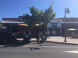 Bikes curb parked in front of bar